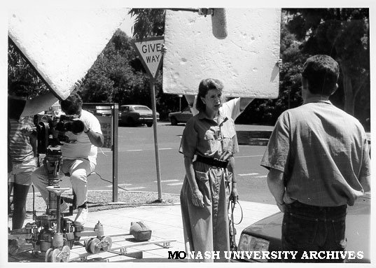 Actors Lisa Armytage and Paul Keenan filming 'Neighbours' on campus
