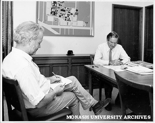 Portraitist Brian Dunlop (left) working on portrait of Professor Ray Martin