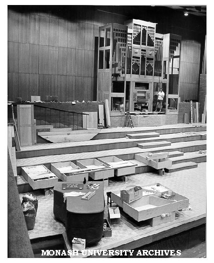 Foreman Herman Schmidt reassembling organ