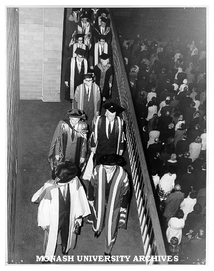 Academic procession leaving Robert Blackwood Hall after opening ceremony