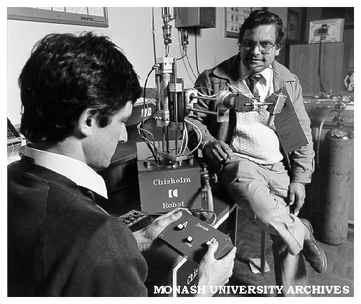 Mr Arvind Shrivastava (right), lecturer in Mechanical Engineering with student Tony Wood at controls of 4DOF Pick-and-Place-Robot