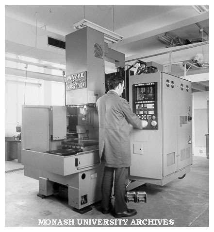 MAZAK vertical CNC machine centre with Mechanical Engineering workshop technician Mr Ivor Little at controls