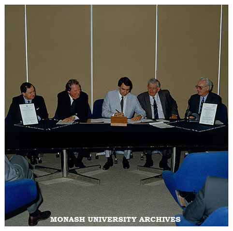 Signing of Monash Chisholm Heads of Agreement. Mr Peter Wade (left), Professor Mal Logan, Mr Paul Ramler, Dr Geoff Vaughan and Dr Graham Trevaskis
