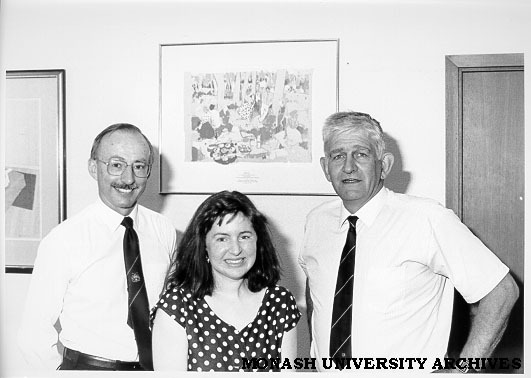 Gift to commemorate RMIT centenary. Director of Chisholm Dr Geoff Vaughan (right) with Director of RMIT Dr Brian Smith and Chisholm Fine Art student Michele Kilroy, in front of her gift print