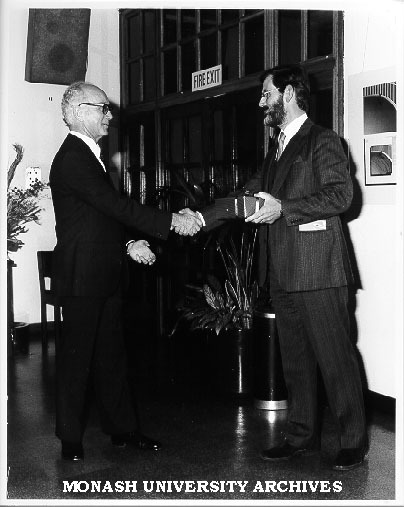 Mr Ted Worsley receiving presentation from Mr Robert Strand