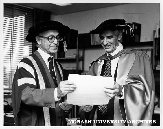 Deputy Chancellor Dr Joe Isaac (left) presenting Emeritus Professor Don Cochrane with honorary Doctor of Economics