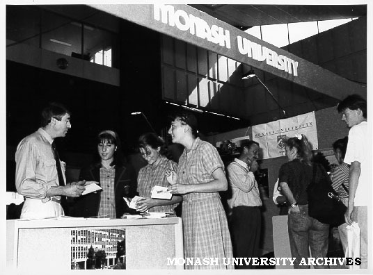 Graduate Careers Show, Exhibition building. Careers and Appointments manager Bryan Barwood, talking to students from Fintona Girls School