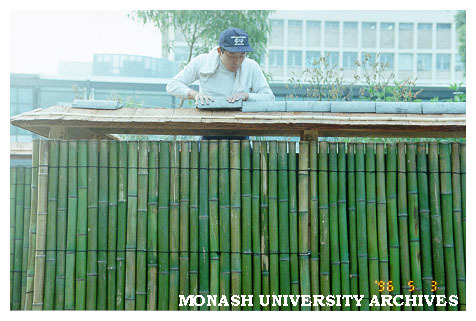 Cutting tiles for roof of Kenninji style fence, Japanese Garden