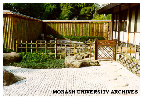 Yotsume style fence, Japanese Garden and gate leading from the stone (sekitei) garden, into the dry landscape (karesansui) garden