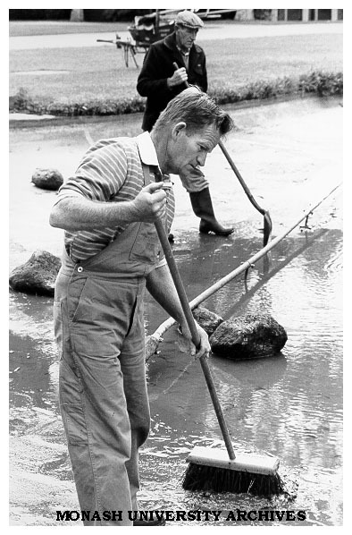 Groundsman Bernie Eccles cleaning pond in forum