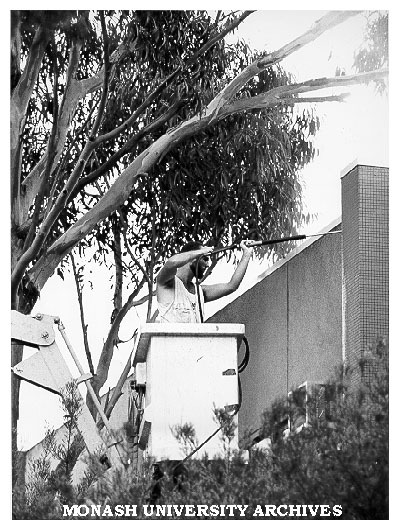 Contractor Philip Waters cleaning south wall of Union building