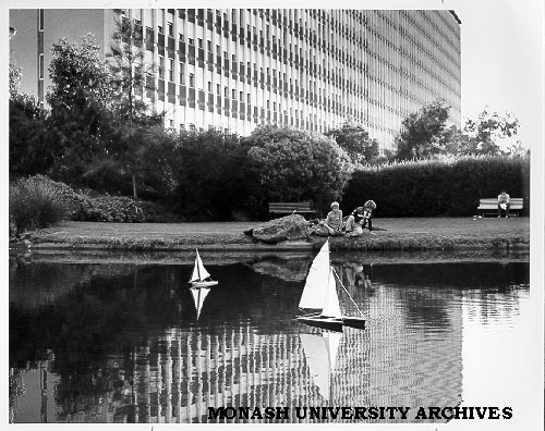 Model yachts on pond with Menzies building in background
