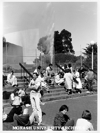 Students outside Law School with broken water main in background