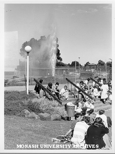 Students outside Law School and broken water main in background