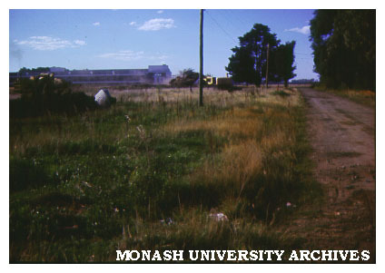 View of grounds, original buildings in background