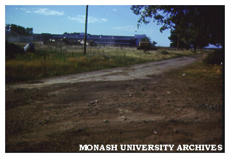 View of grounds, original buildings in background