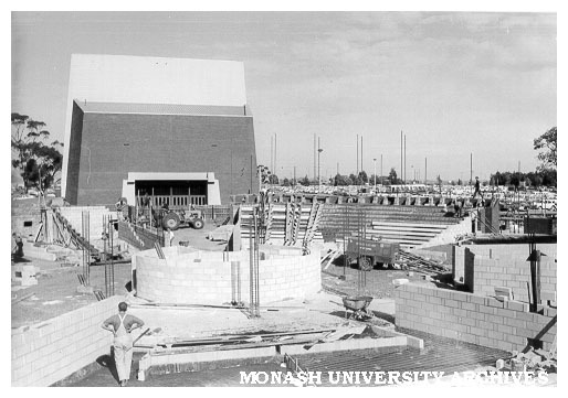 Early construction of rotunda with Alexander Theatre in background