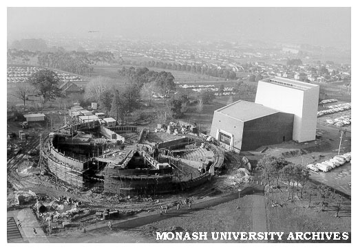 Early construction of rotunda with Alexander Theatre at right