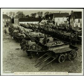 Army Service Corps wagons in a village square in Northern France