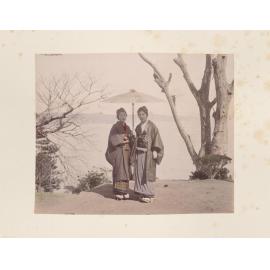 Two women under a parasol 