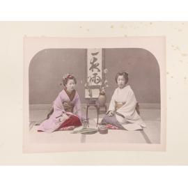 Two women arranging flowers
