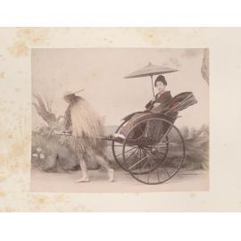Woman being transported in a rickshaw