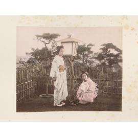 Two women by a lantern