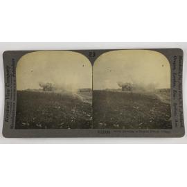 Shells bursting in ruined French village