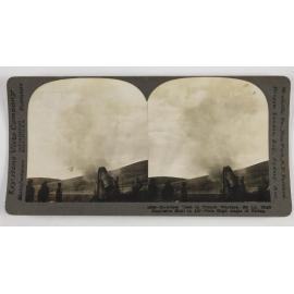 Howitzer used in trench warfare.  800 lb. high explosive shell in air-note high angle of firing