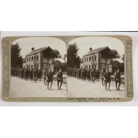 London territorials passing a ruined house on the shell swept La Bassee Road
