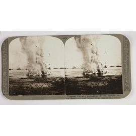 Trapped German submarine drivin inshore by our destryoer and blown clean out of the water