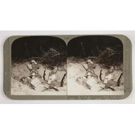 Hazardous work in listening-post, a shell crater in "no Man's Land" near Lagnicourt