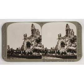 Bosche prisoners guarded by French troops beside Albert Cathedral, wrecked by shell fire