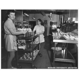 Catering staff members with desserts to be served