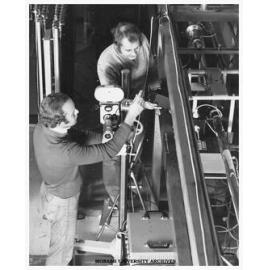 Chemical engineering postgraduate student Peter Cable and Dr David Boger preparing to film in the lab