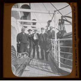 Passengers posing for a photo on ship 