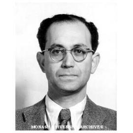 Professor J.E. Isaac, Chair of Economics