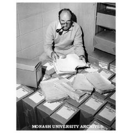 Dr Geoffrey Serle with Monash papers