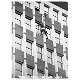 Cleaning north face of Menzies Building