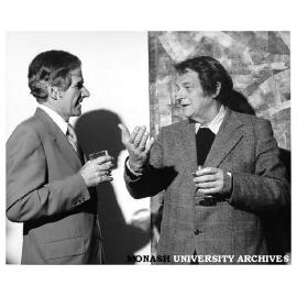 Professor Ray Martin and artist Roger Kemp at the opening of the Cycles and Directions exhibition, in front of Kemp's work 'Aerial Rhythm' (1973) in the Visual Arts gallery