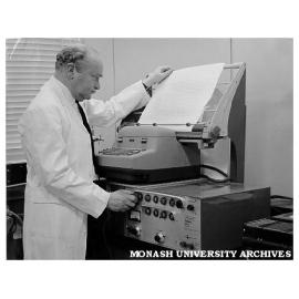 Professor Joseph Bornstein studying results obtained during work on diabetes drug ACG
