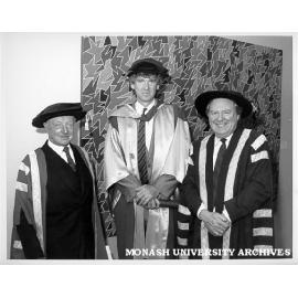 David Williamson (centre) after receiving Doctor of Letters, with Chancellor Sir George Lush (left) and Vice-Chancellor Professor Mal Logan
