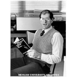 Dr Don Bowden with dictionary written to assist medical staff in Vanuatu