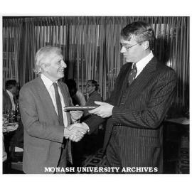 Professor Merle Ricklefs (right) making presentation to Dean of Arts Professor John Legge