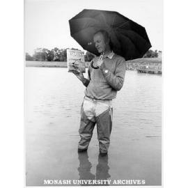 Dr Sam Lake, Director of Centre for Stream Ecology, with book 'Australian Wetlands'