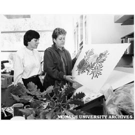 Senator Kay Patterson (left) and Celia Rosser with banksia watercolour