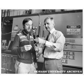 Associate Professor John Agnew (right) and student Donald Rogers examining synthetic crude