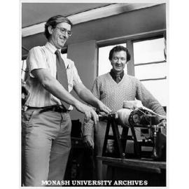 Professor Roy Jackson (left) and Dr Frank Larkins loading autoclave into furnace