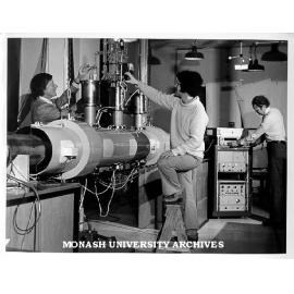 Professor Ron Brown (left), student John Storey and Dr Peter Godfrey adjusting apparatus in lab