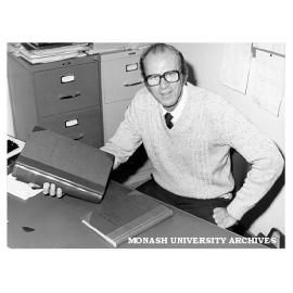 Dr David Collins with sample of book binding hobby